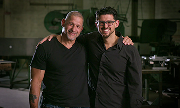 employees smiling and posing for picture